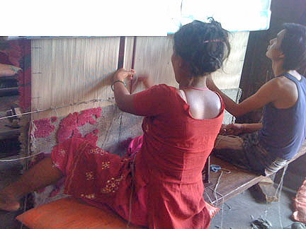 Rug weaver in Nepal weaving a 5Under40 rug