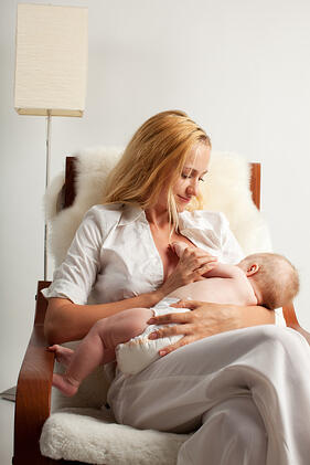 mother breastfeeding after breast augmentation