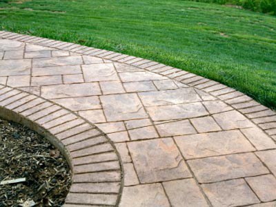 comparison of stamped concrete vs Pavers Landscaping