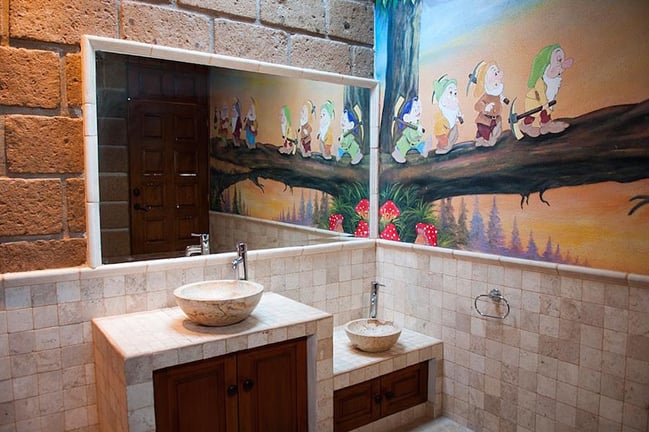 In the children's bathroom, the Seven Dwarves offer some cheery encouragement when it's time to get ready for bed. In the children's bathroom, the Seven Dwarves offer some cheery encouragement when it's time to get ready for bed.