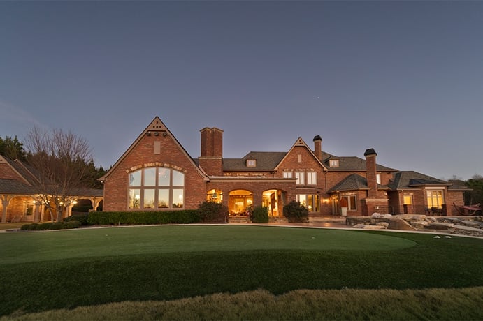 The facade of Smoltz’s 10-bedroom Milton, Georgia, residence is clad in warm-hued brick, and features Craftsman-style carved wood details. The facade of Smoltz’s 10-bedroom Milton, Georgia, residence is clad in warm-hued brick, and features Craftsman-style carved wood details.