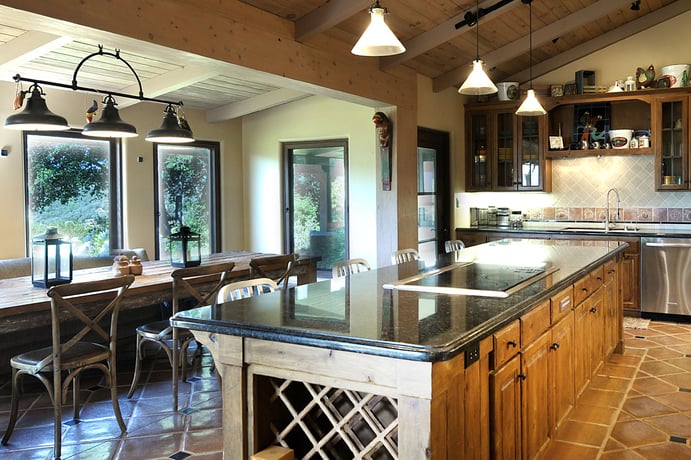 A modernized kitchen is notable for its openness and natural lighting. A modernized kitchen is notable for its openness and natural lighting.