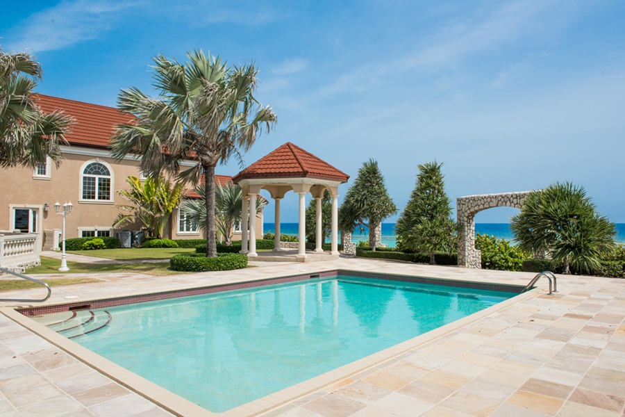 The terrace of this elegant abode overlooks the turquoise waters of the Caribbean on Grand Cayman’s north side. The terrace of this elegant abode overlooks the turquoise waters of the Caribbean on Grand Cayman’s north side.