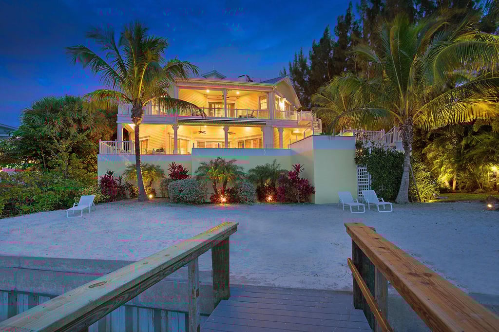 A picture-perfect sandy beach is just steps from the house, providing a peaceful perch for watching the waves or a spectacular sunset. A picture-perfect sandy beach is just steps from the house, providing a peaceful perch for watching the waves or a spectacular sunset.