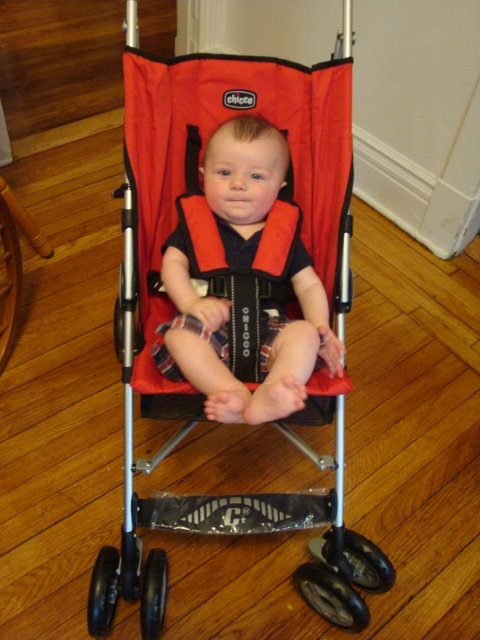 Emmett in his red Chicco umbrella stroller