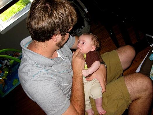 James & Gus James keeping Gus pacified on a yoga ball