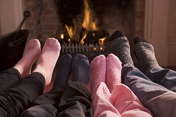 photodune-340340-family-of-feet-warming-at-a-fireplace-xs
