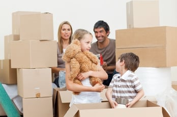 family-unpacking-boxes-after-move-in-xs