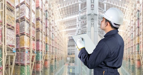 factory worker doing stock take