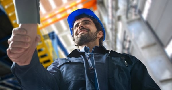 Man shaking hands with another person