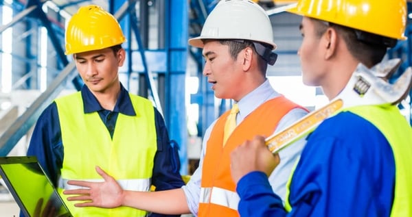 manufacturing workers having a discussion
