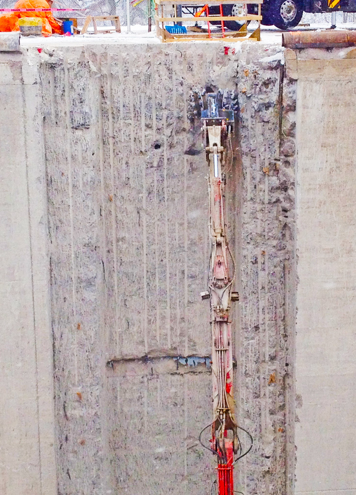 Long reach excavator concrete scaling2