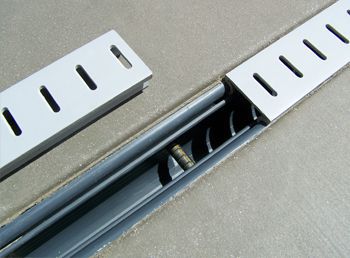 Pool deck slot drain