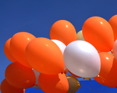orange white balloons sky