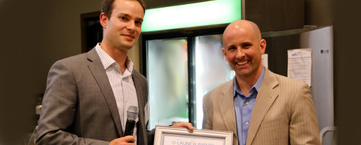 TechBridge's Jeff McAulay presents Retroficiency with their U-Launch Award. Image courtesy of Cleantech Open / Lindsay Davis