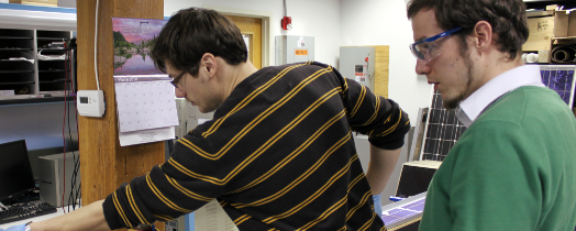 #htmlcaption1 CSE Fellow Matthias Winter examines a solar module in progress.