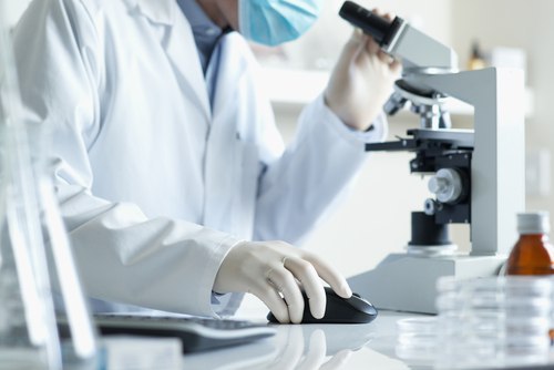 Infertility Specialist Examining Sperm
