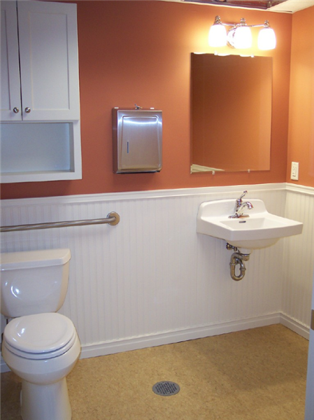 Custom partitions were fabricated for this commercial bathroom along ...