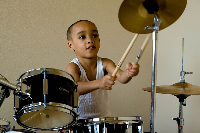 kid playing drums