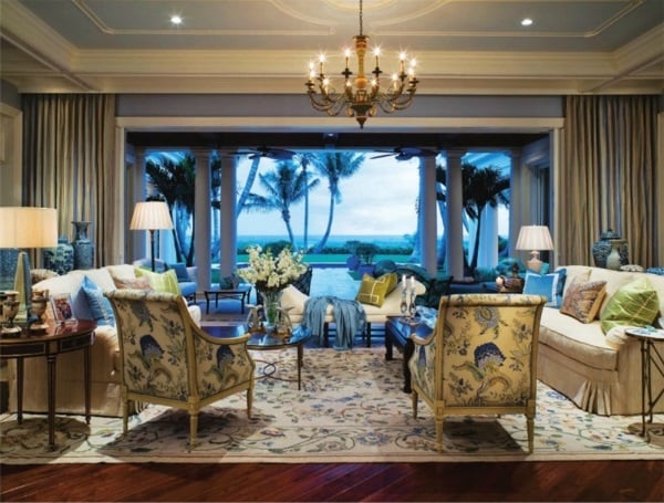  cream, blue, yellow and green floral needlepoint rug enlivens a seaside Palm Beach living room by Marc-Michaels Interior Design