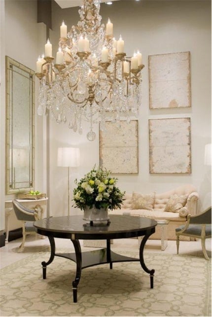 cream and green geometric needlepoint rug allows brings calm and refinement to elegant living room with fine antiques and crystal chandelier designed by Frank Babb Randolph