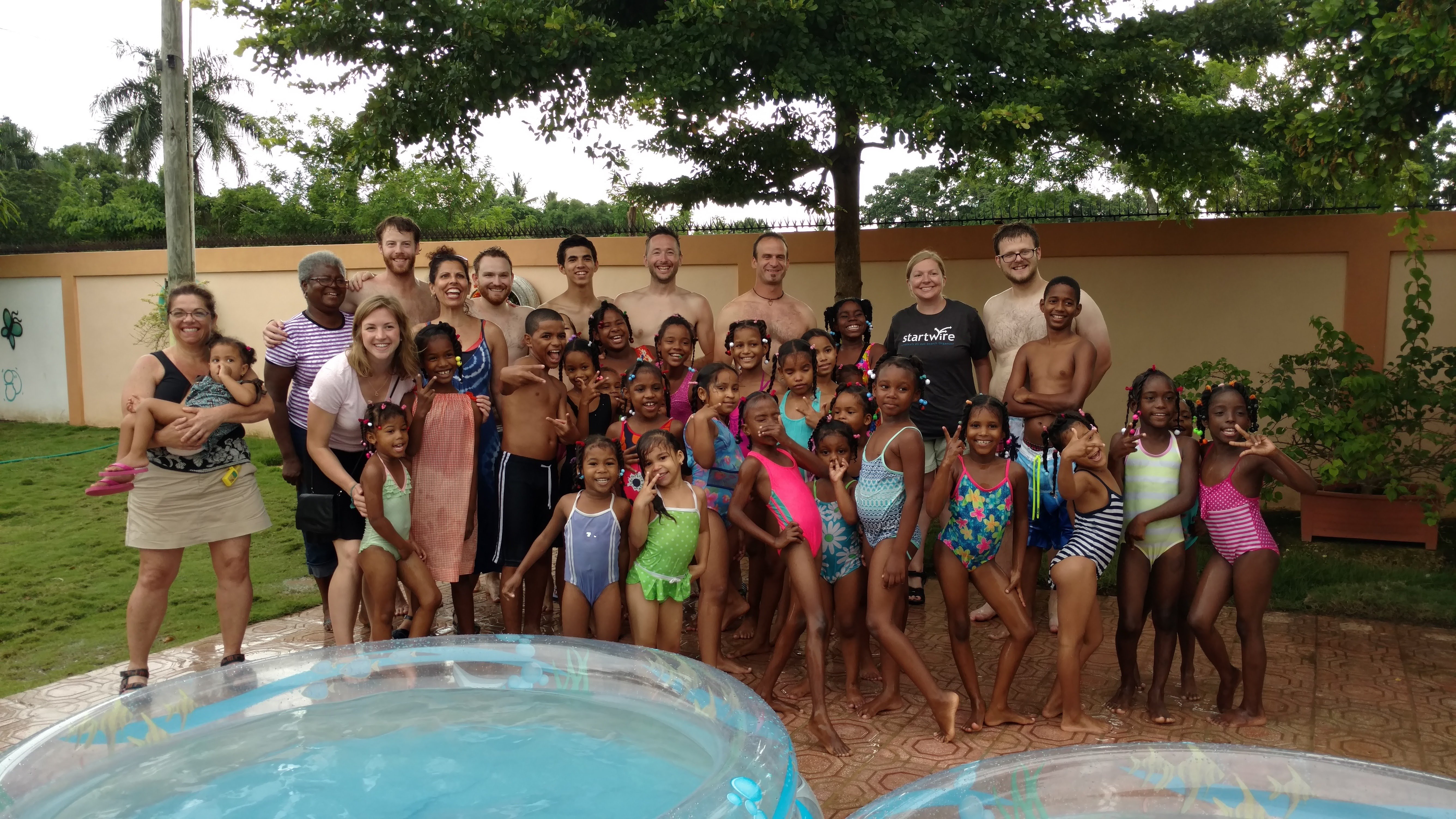 Visiting Mariella's girls home brought many smiles and lots of swimming in kiddie pools!