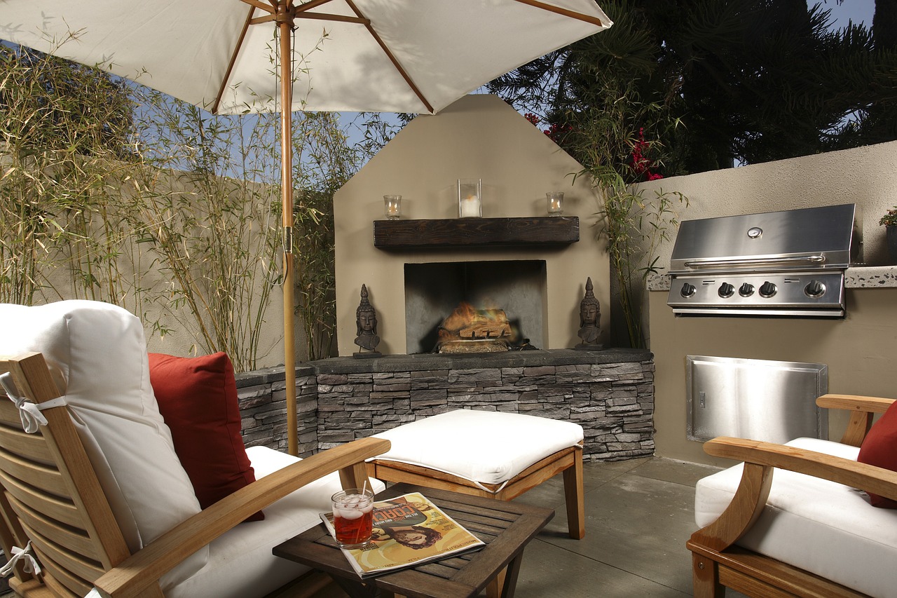 outside living space with built in kitchen fireplace features