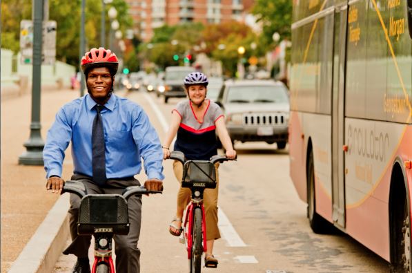 Two_people_biking.jpg