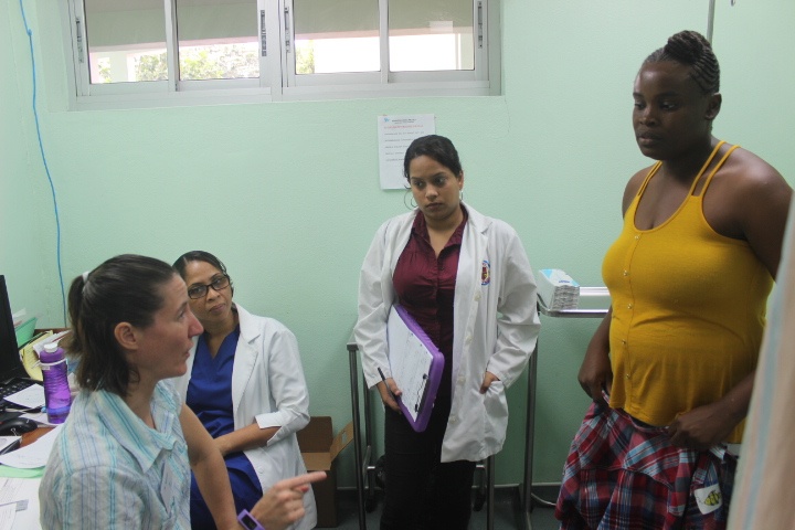 Surgeons talk to the parents of a patient on consultation day