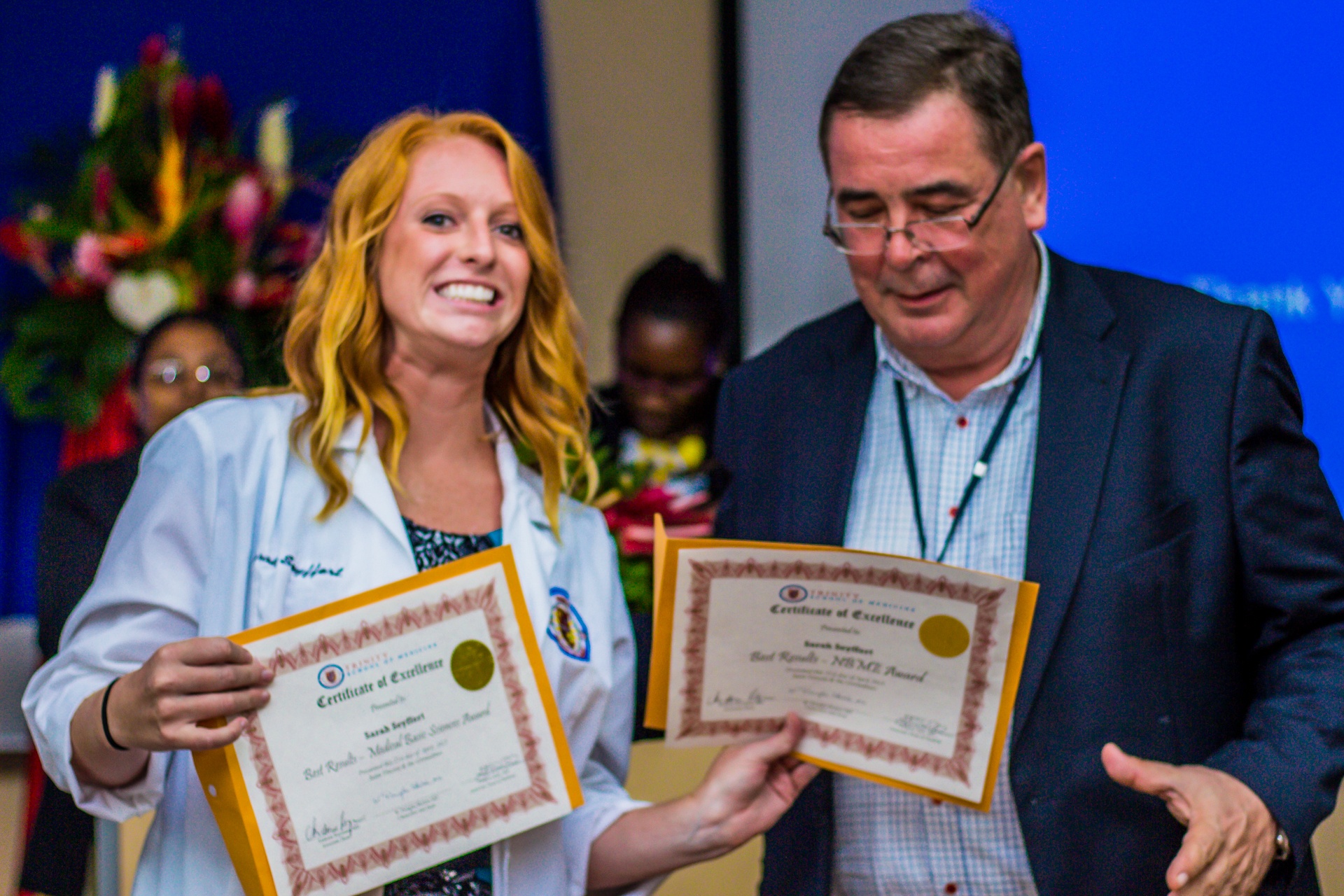 Dr. Andreas Reymann and Sarah Seyffert with her two awards