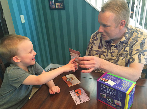 man-and-boy-using-language-builder-cards man-and-boy-using-language-builder-cards