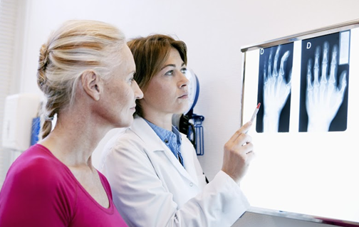 doctor-and-patient-looking-at-xray-results