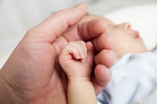 parent-holding-newborn-baby-hand-blog