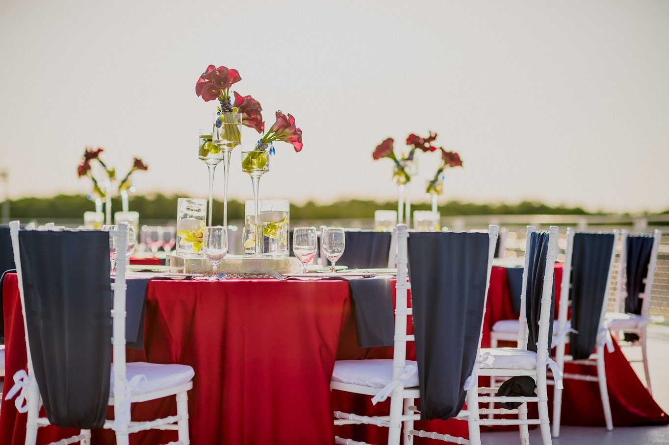 Red Lamour Table Linen with Navy Blue Lamour Chair Ties | BBJ Linen