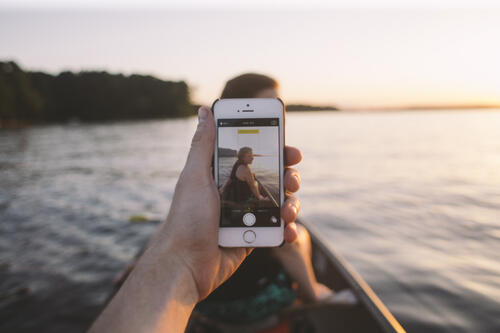 smartphone taking picture of girl at lake, social sharing, social media, devices, smartphones, mobile sharing, garden media group