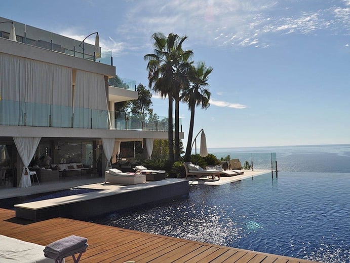 The spacious terraces and porches of this Cala San Vicente villa provide soaring views over the bay. Photograph: Estela Exclusive Homes The spacious terraces and porches of this Cala San Vicente villa provide soaring views over the bay. Photograph: Estela Exclusive Homes