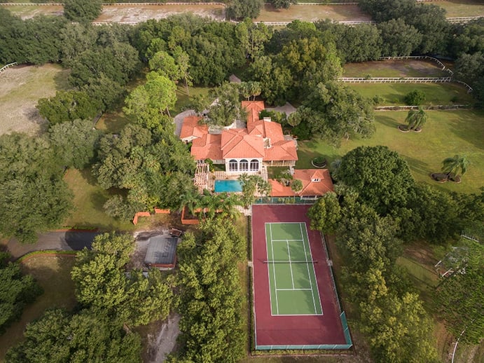Amid 152 acres of lawns, paddocks, and pastures, this well-proportioned equestrian estate is also equipped with a pool and tennis court. Photograph: Regal Real Estate Professionals Amid 152 acres of lawns, paddocks, and pastures, this well-proportioned equestrian estate is also equipped with a pool and tennis court. Photograph: Regal Real Estate Professionals