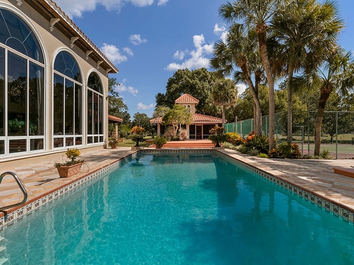 The pool, tennis court, terrace, and summer kitchen offer plenty of opportunities for entertaining and al fresco dining. Photograph: Regal Real Estate Professionals The pool, tennis court, terrace, and summer kitchen offer plenty of opportunities for entertaining and al fresco dining. Photograph: Regal Real Estate Professionals