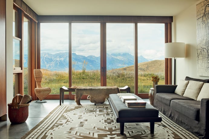 Throughout the 6,489-square-foot home, vast windows reveal the mountain panorama beyond, while automated fabric and bespoke wooden blinds introduce cozy privacy at the touch of a button. Throughout the 6,489-square-foot home, vast windows reveal the mountain panorama beyond, while automated fabric and bespoke wooden blinds introduce cozy privacy at the touch of a button.