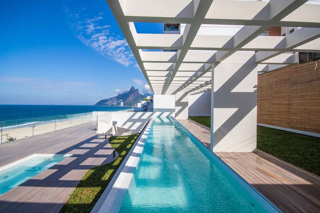 A stunning lap pool points to Ipanema Beach and Sugarloaf from the terrace of this Rio de Janeiro masterpiece.