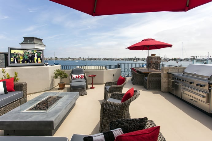 Bay views are in competition with the on-screen action at this home’s entertaining area, complete with HDTV, fireplace, lounge, dining area, and commercial-grade grilling station. Bay views are in competition with the on-screen action at this home’s entertaining area, complete with HDTV, fireplace, lounge, dining area, and commercial-grade grilling station.