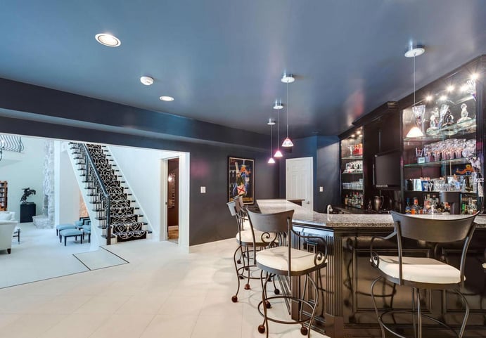 This designer home has a stellar lineup of amenities; in addition to a contemporary screening room, there is a cocktail lounge, catering kitchen, game room, tropical pool area, and tennis court, offering a unique resort experience just 20 minutes outside Washington, DC. This designer home has a stellar lineup of amenities; in addition to a contemporary screening room, there is a cocktail lounge, catering kitchen, game room, tropical pool area, and tennis court, offering a unique resort experience just 20 minutes outside Washington, DC.