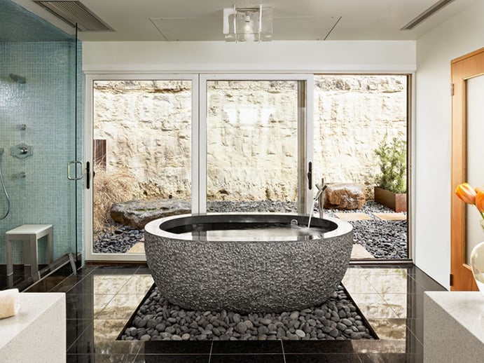 Winn Wittman Architecture provides interior design expertise to select fixtures and finishes that work in harmony with the home. Pictured is an award-winning bath at Soaring Wings, featuring a granite tub and river rocks. Winn Wittman Architecture provides interior design expertise to select fixtures and finishes that work in harmony with the home. Pictured is an award-winning bath at Soaring Wings, featuring a granite tub and river rocks.