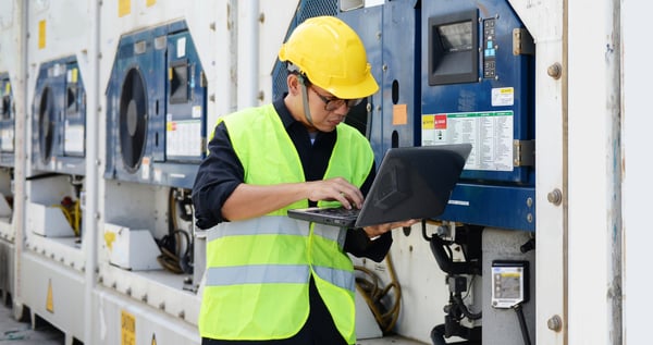 technician-looking-at-laptop