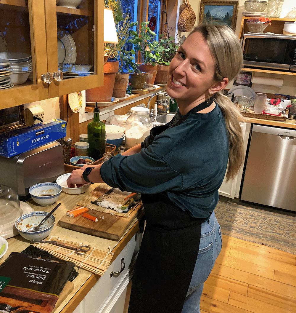 Rory making sushi in a kitchen.
