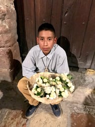 kid selling gardenias