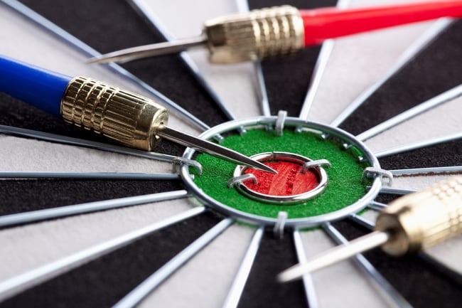 Extreme close up of three darts lying on their side around a bull's eye Image number: 1570R-140779 License type: Royalty Free Credit: fStop Images