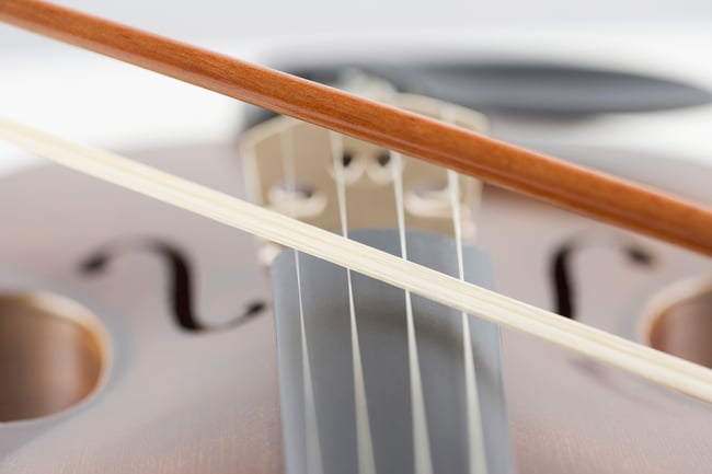 Extreme closeup of violin and bow Image number: 1795R-9054 License type: Royalty Free Credit: Tetra Images