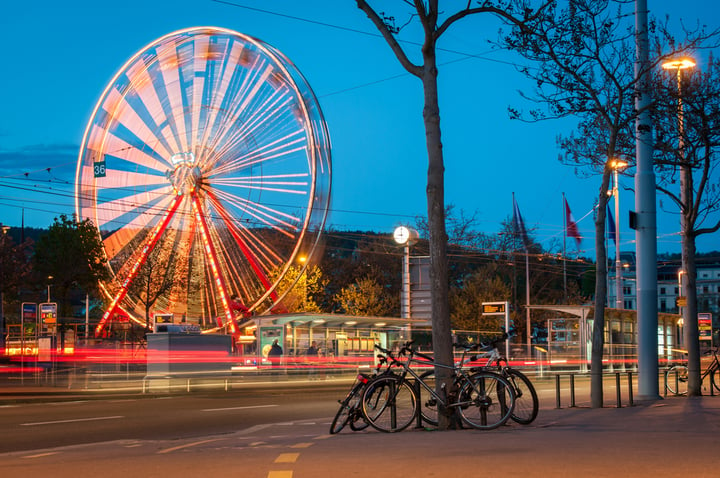 Ferris wheel and street traffic in Zurich
