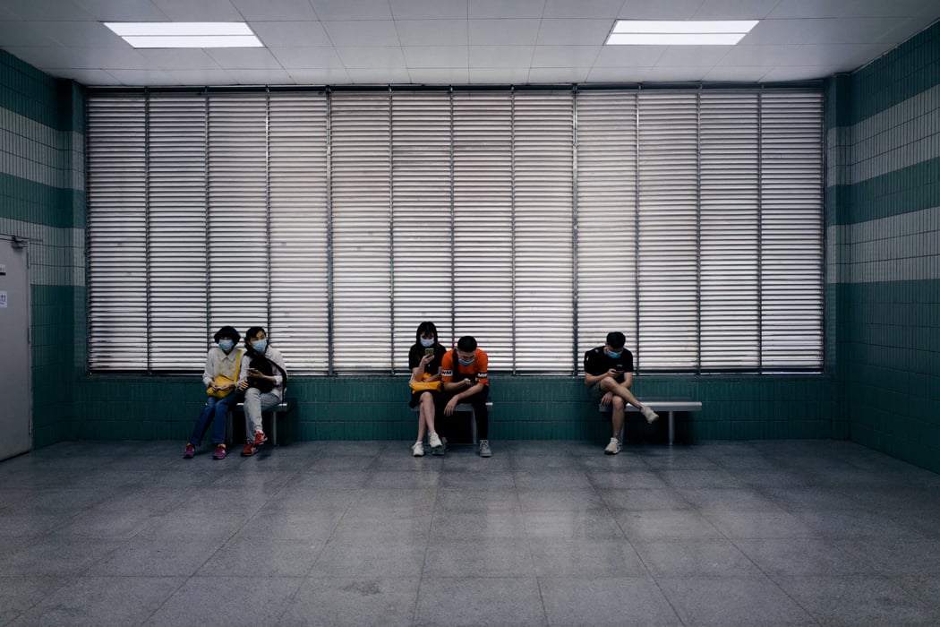 Individuals sitting in a waiting room